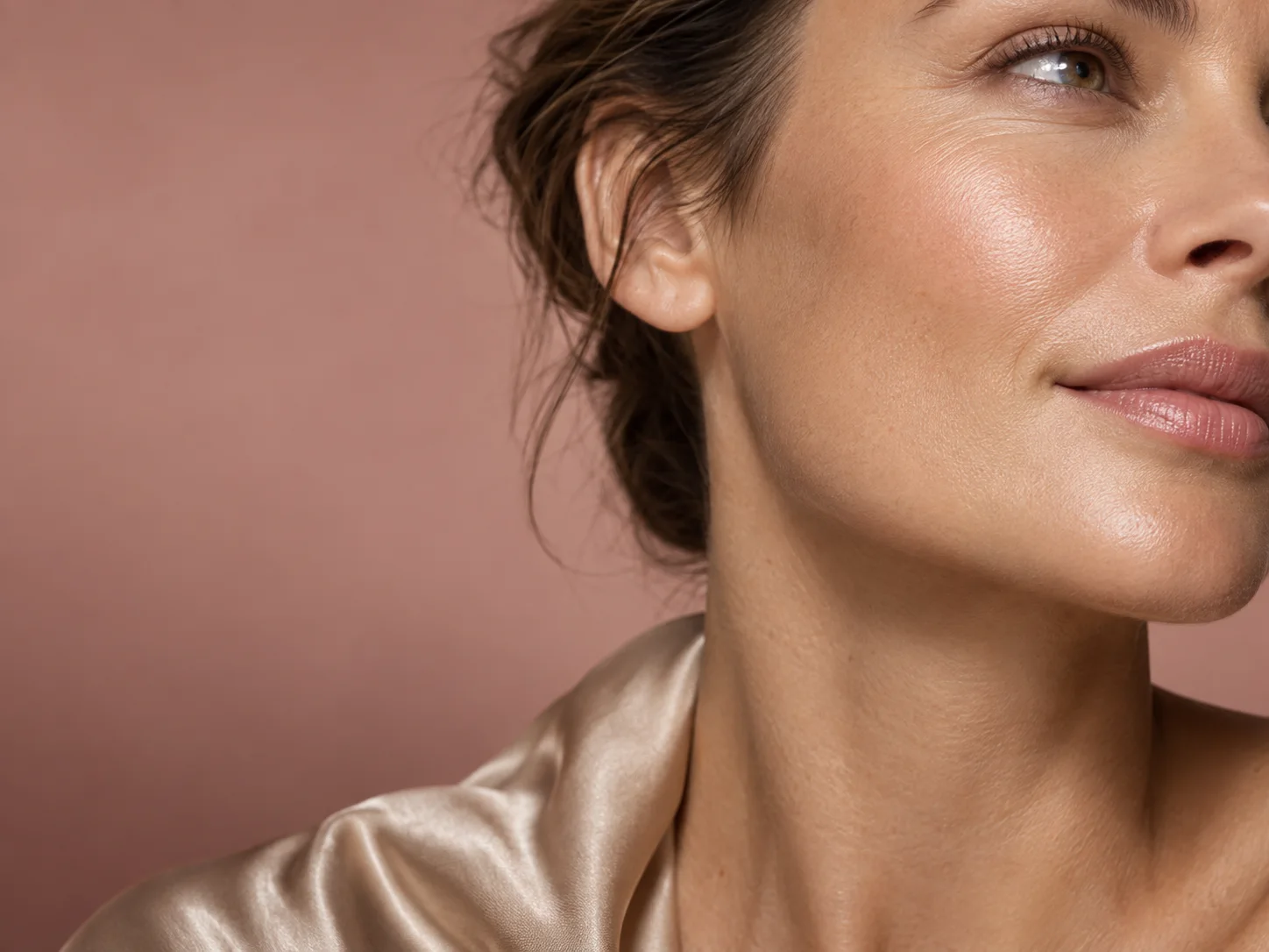 Conceptual close-up of natural skin and a champagne silk collar